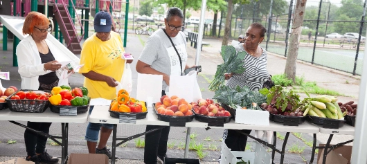 Women selecting fresh fruit and vegetables