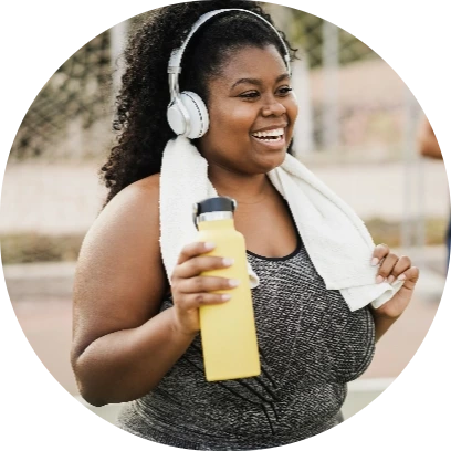 Young women exercising while listening to music on her headphones