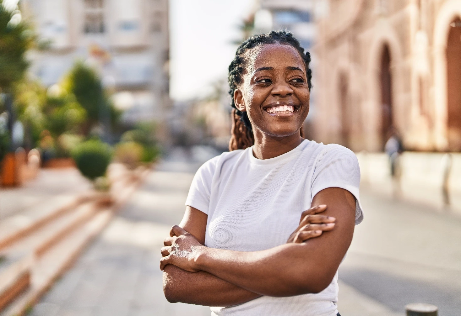 Young women standing in the street, smiling